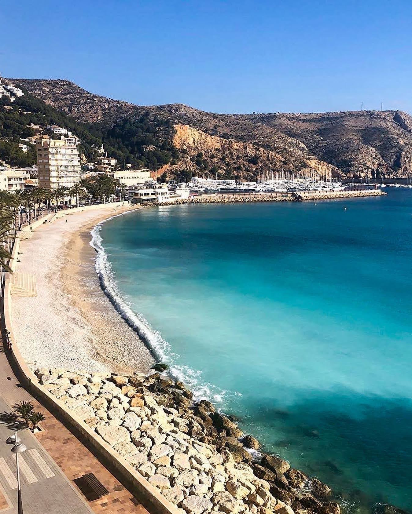 Arenal beach and Jávea harbour on a clear day